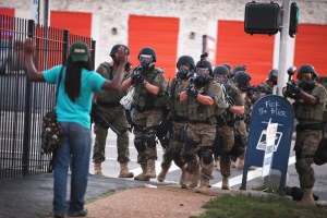 Ferguson police officers in riot gear.